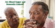 Is There a Link Between Blood Sugar and Dementia? Picture of a black female looking concerned for a black male who seems lost in thought.