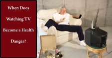 How Much Is Too Much When Watching TV? Picture of a middle aged caucasian male sitting on the couch watching TV and eating pizza.